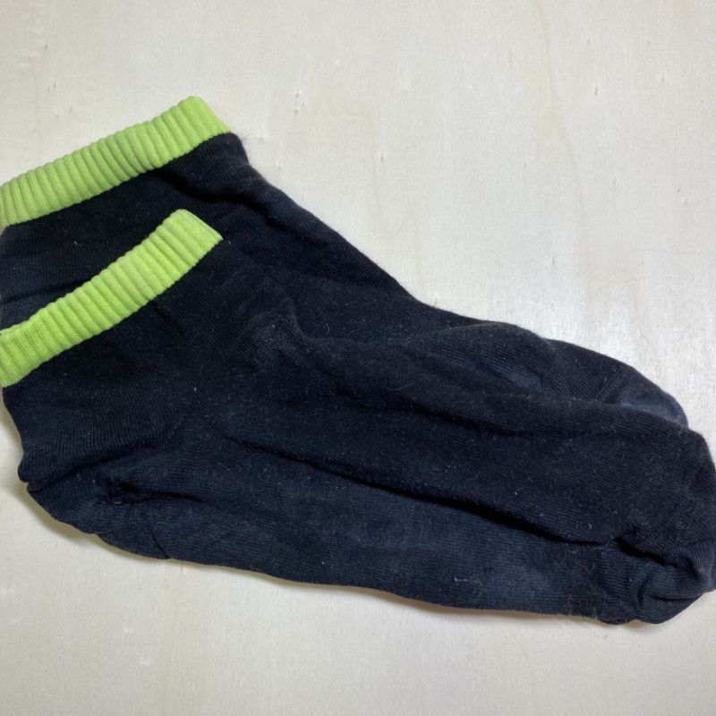 old black socks with a green stripe