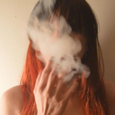 Photoshooting smoking undressing