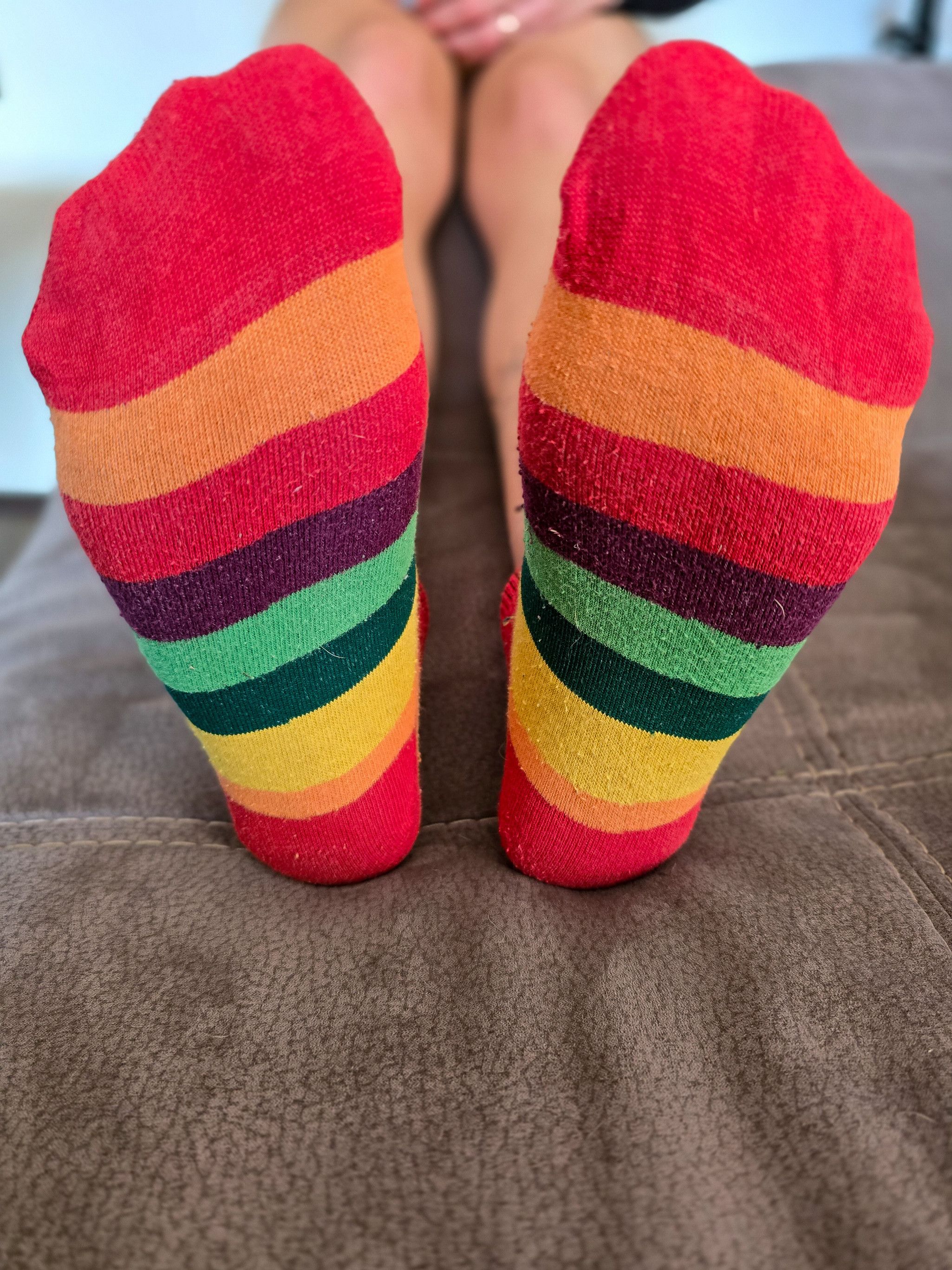 worn rainbow sneaker socks