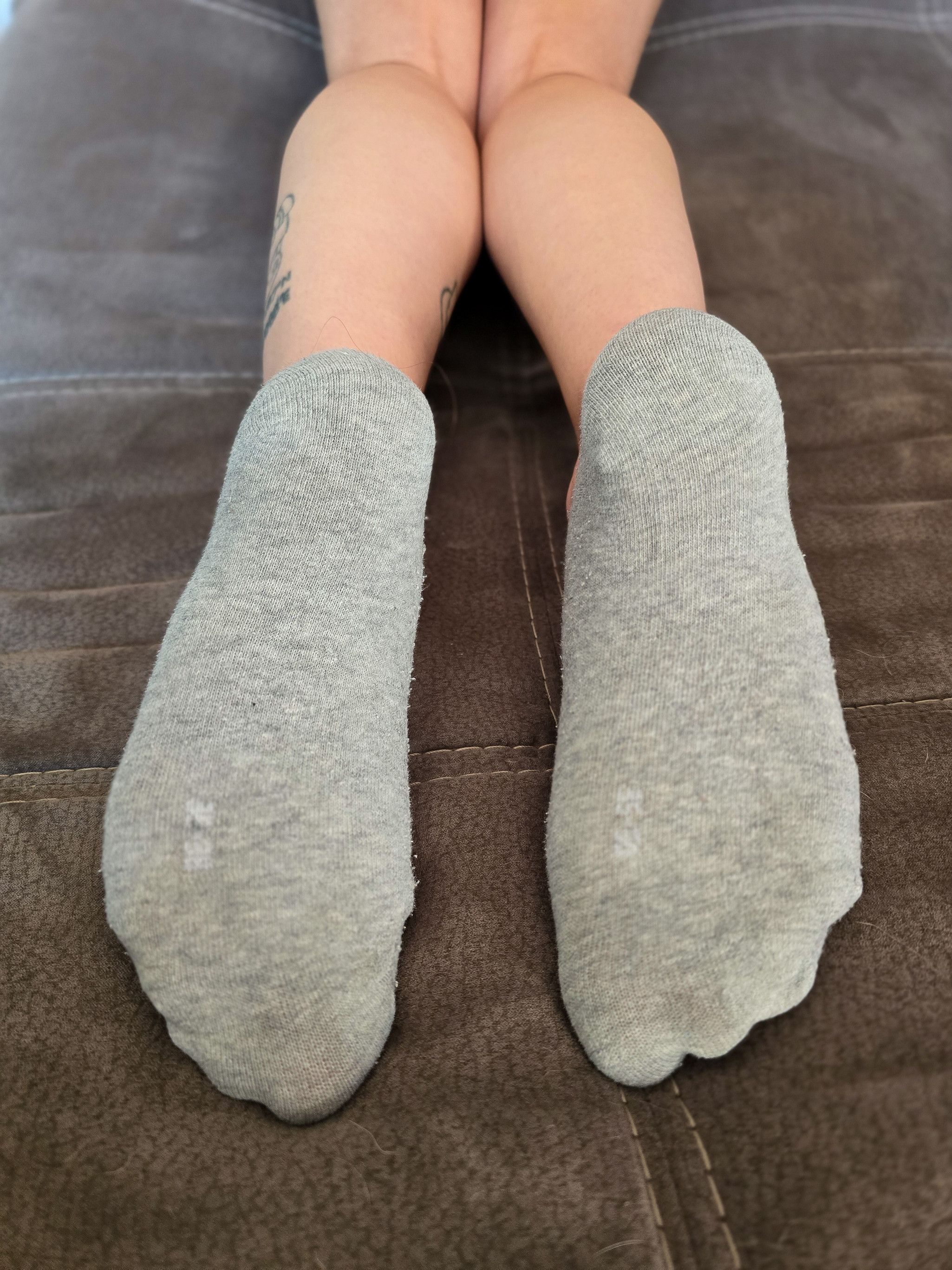 worn gray no show socks