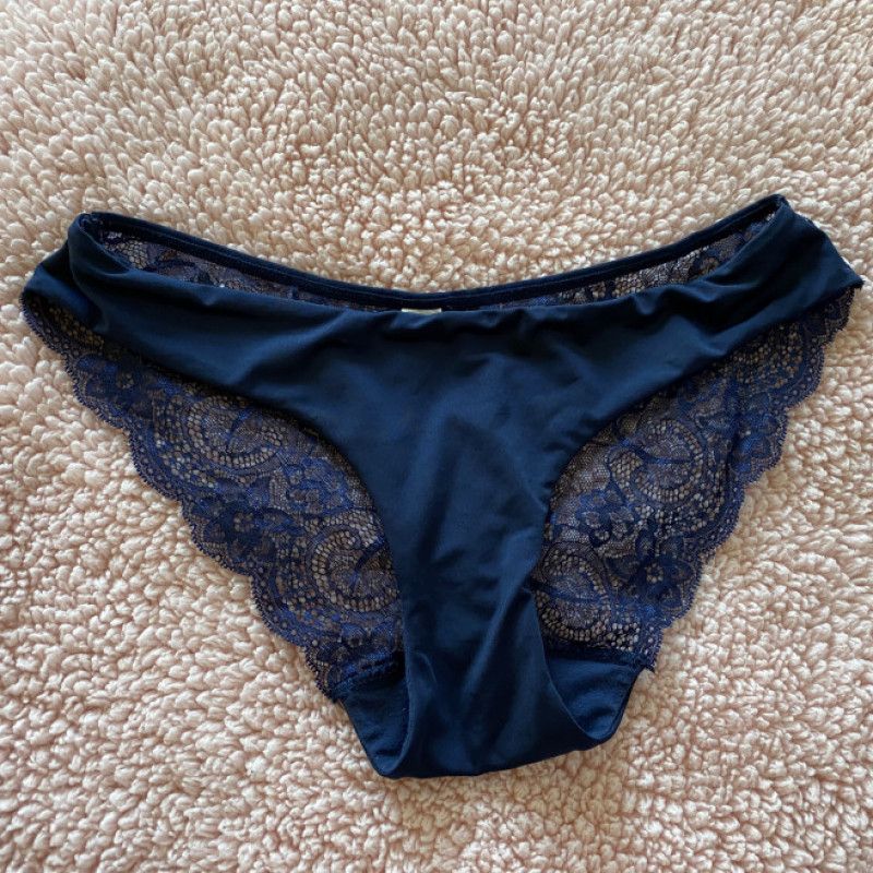 Worn navy blue lace and nylon panty