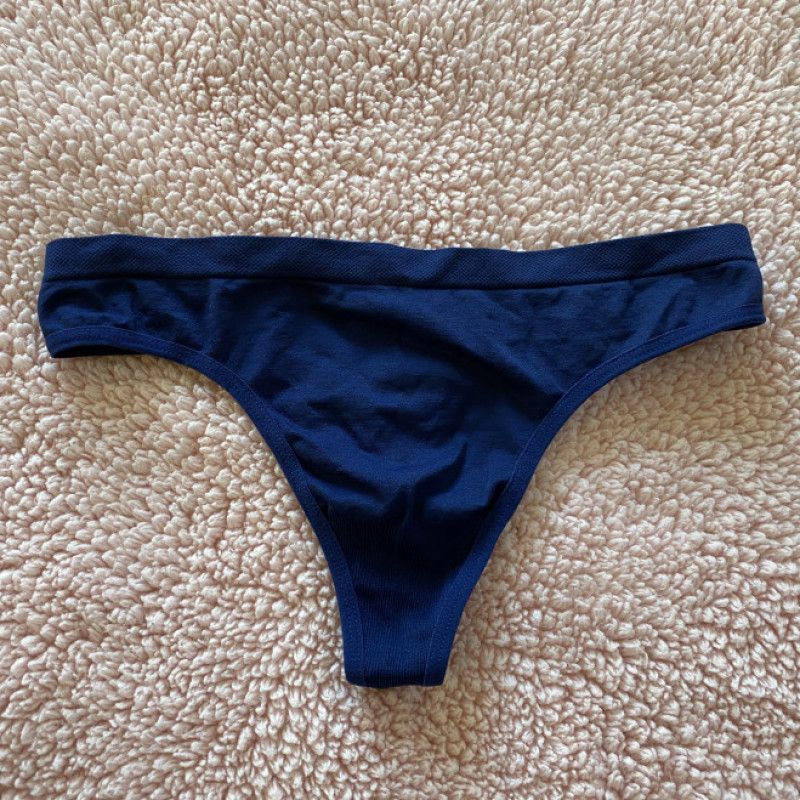 Worn dirty navy blue nylon spandex thong