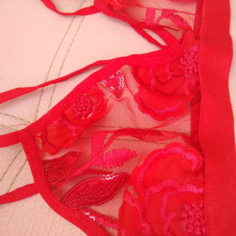 Two cute white and red lace bra