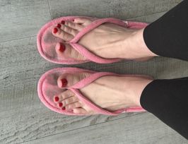 Well worn pink thong slippers