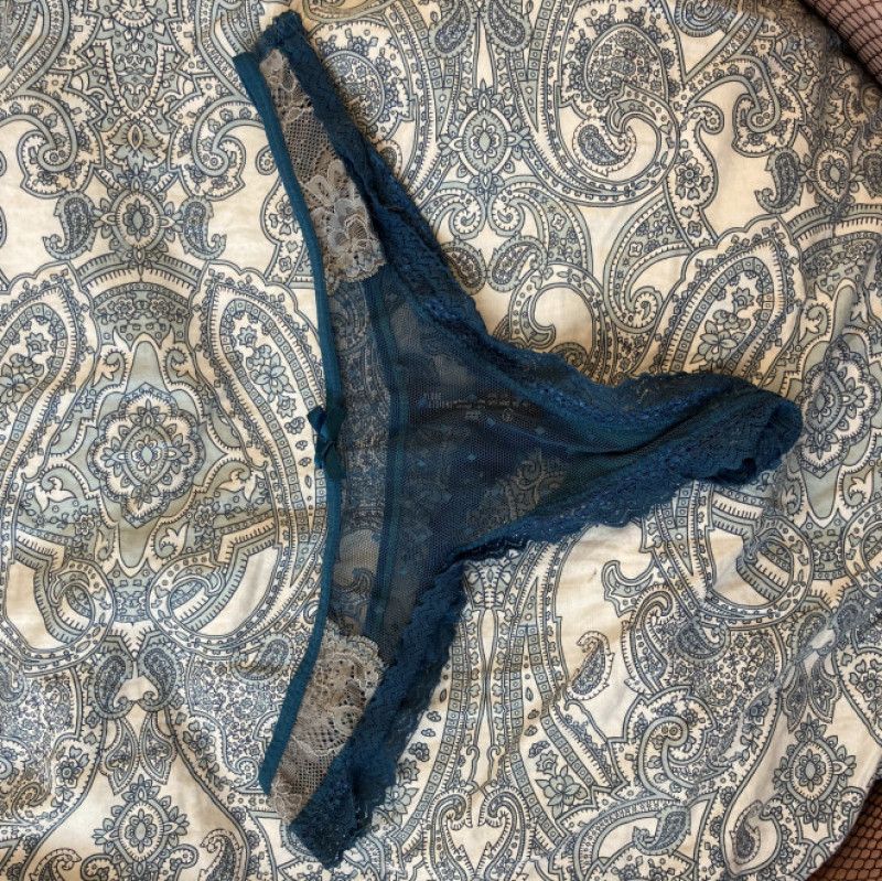 Blue lace thong panties worn