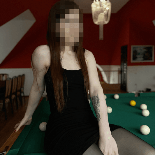 Pool table in black dress with pool balls