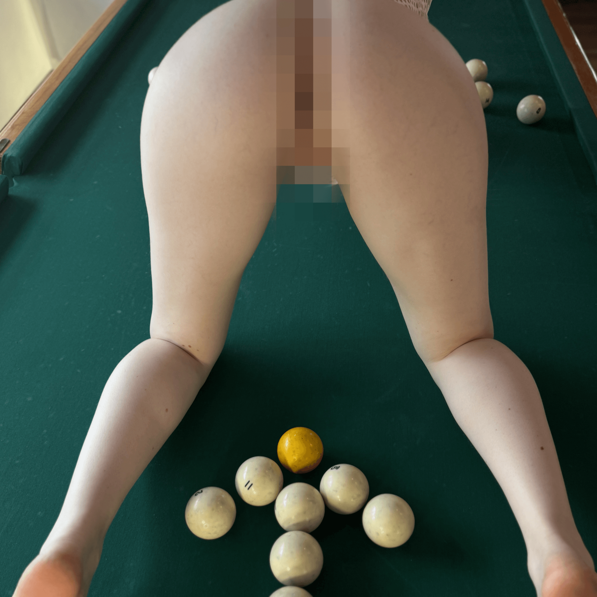 Pool table in black dress with pool balls