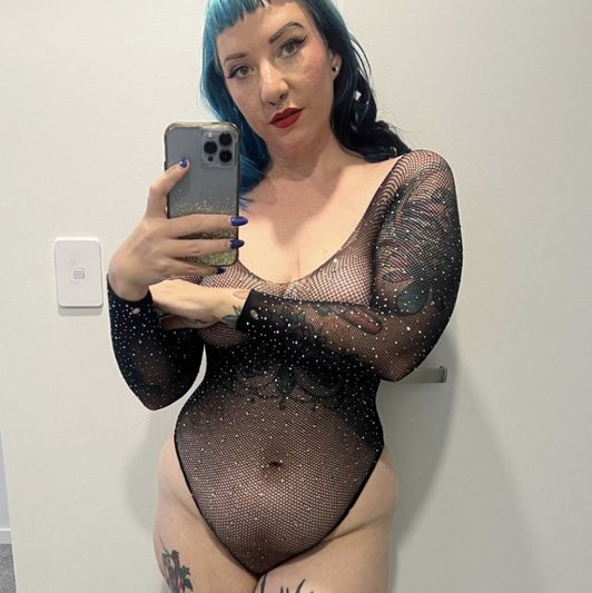 Well used ripped fishnet bodysuit