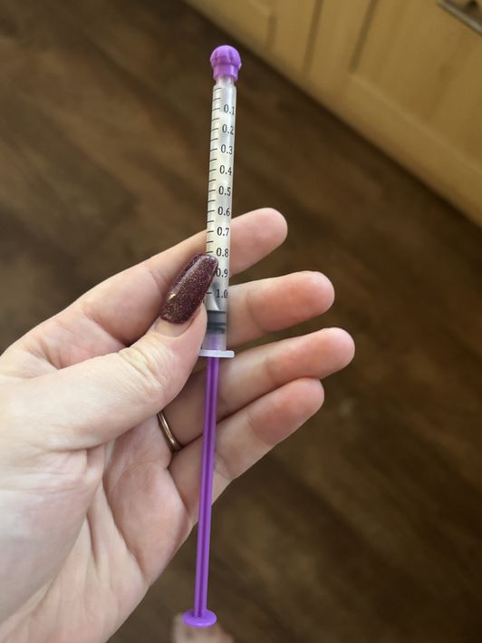 Syringe of colostrum breast milk