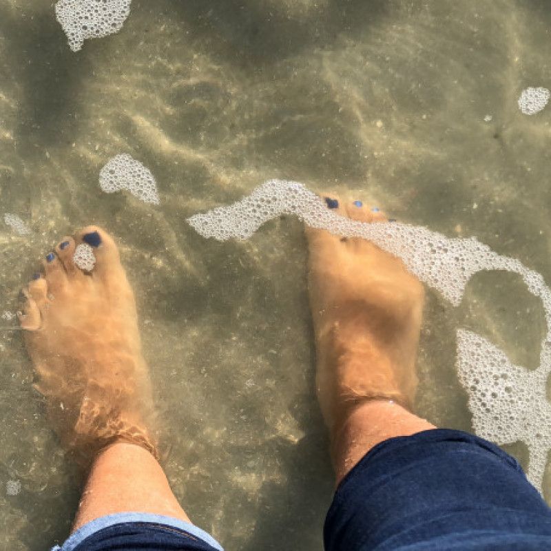 Feet  underwater at the beach 