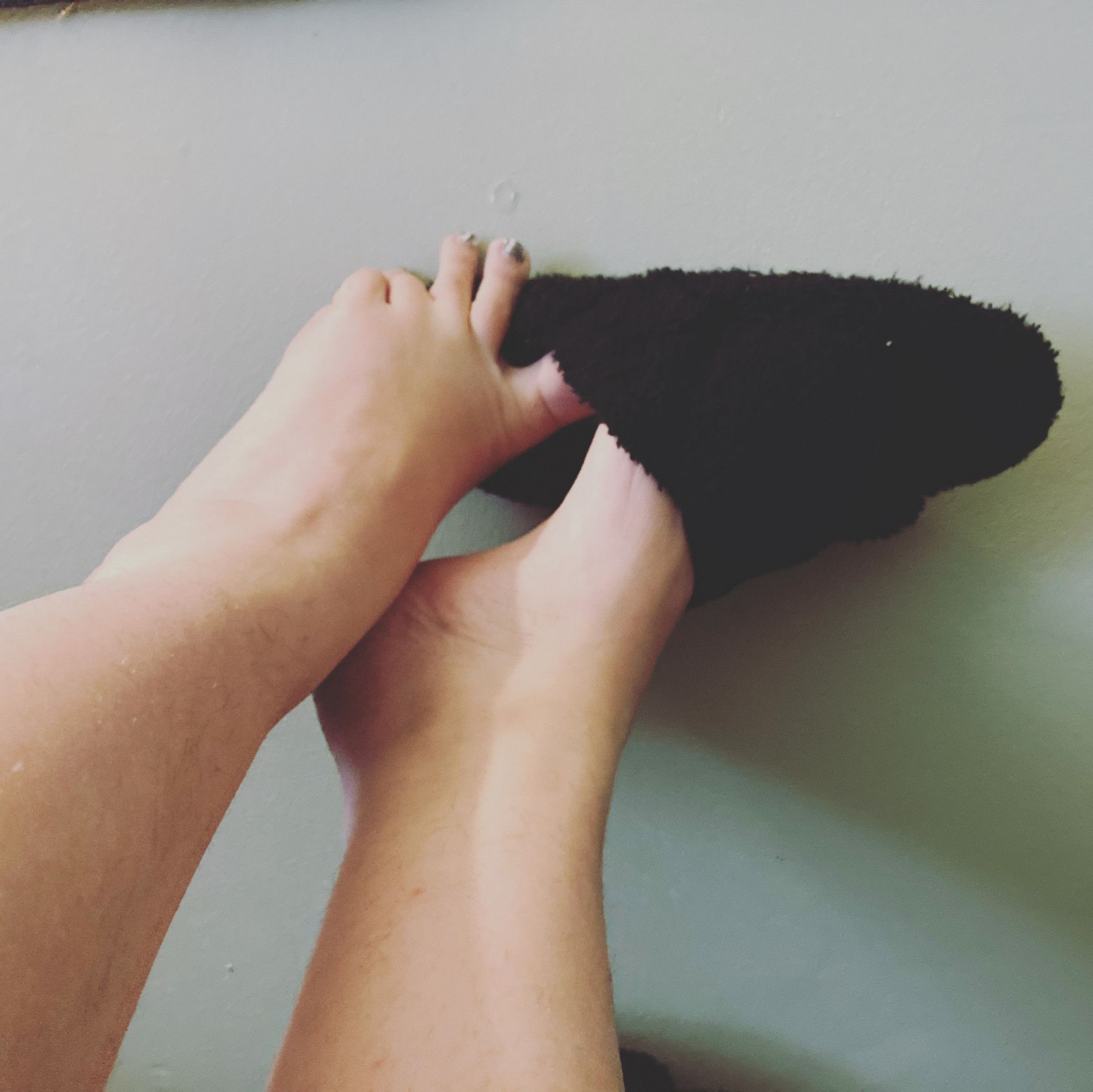 stinky black fuzzy slippers