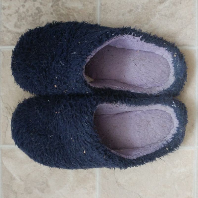 Fluffy worn house shoes