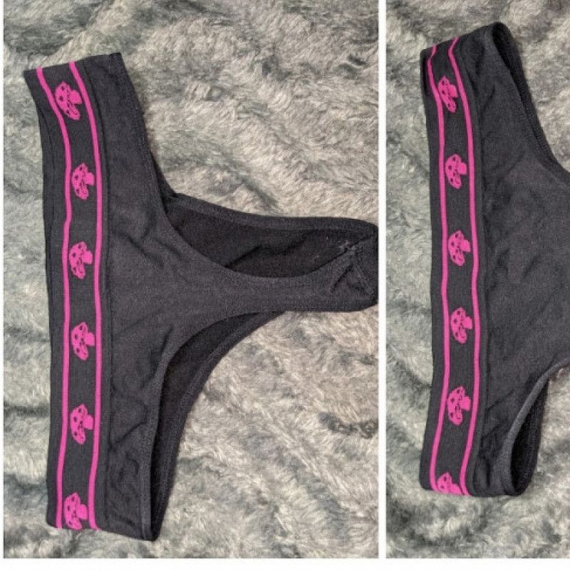 Black thongs with pink mushrooms lining