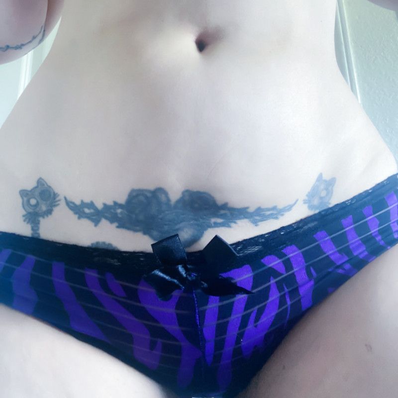 Worn full back purple and black panties