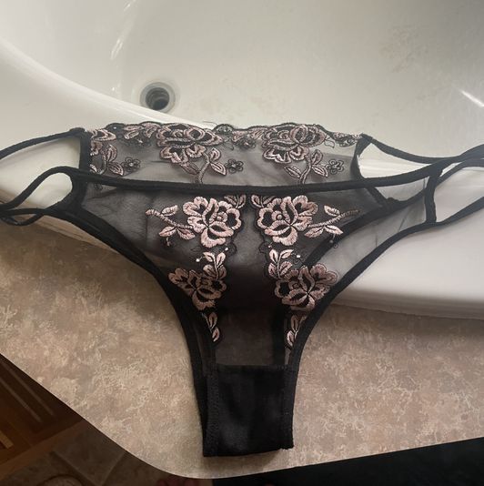 Sheer black panties with pink rose embroidery