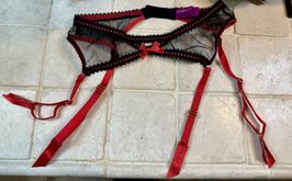 Red and black garter owned and worn by Hot Wife Rio