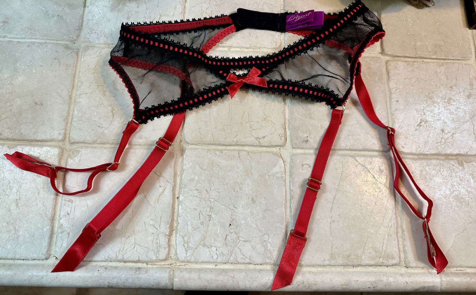 Red and black garter owned and worn by Hot Wife Rio