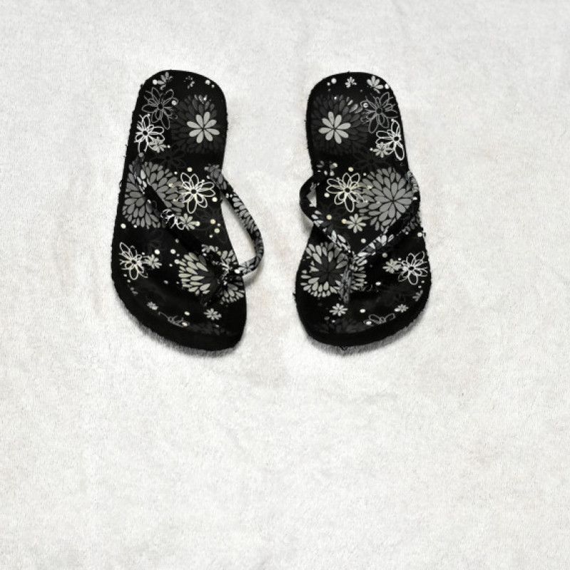 Black flip flop with white flowers