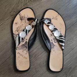 Very Worn Zebra Print Flip Flops