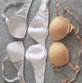 Three worn bras