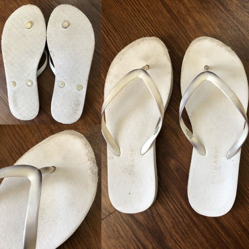 Well Worn Discolored White Flip Flops