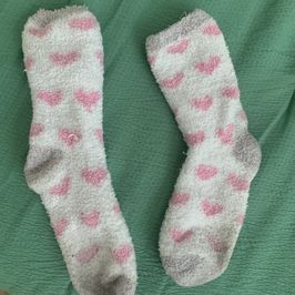 White fuzzy socks with pink hearts