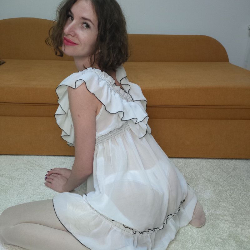 Photo set in white stockings panties and dress