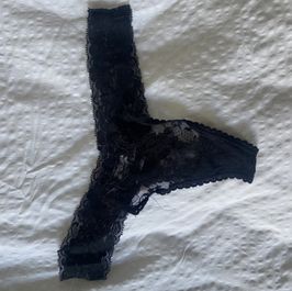 Black lace thong worn