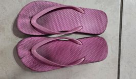 Well Worn Pink Flip Flops With Toe Prints