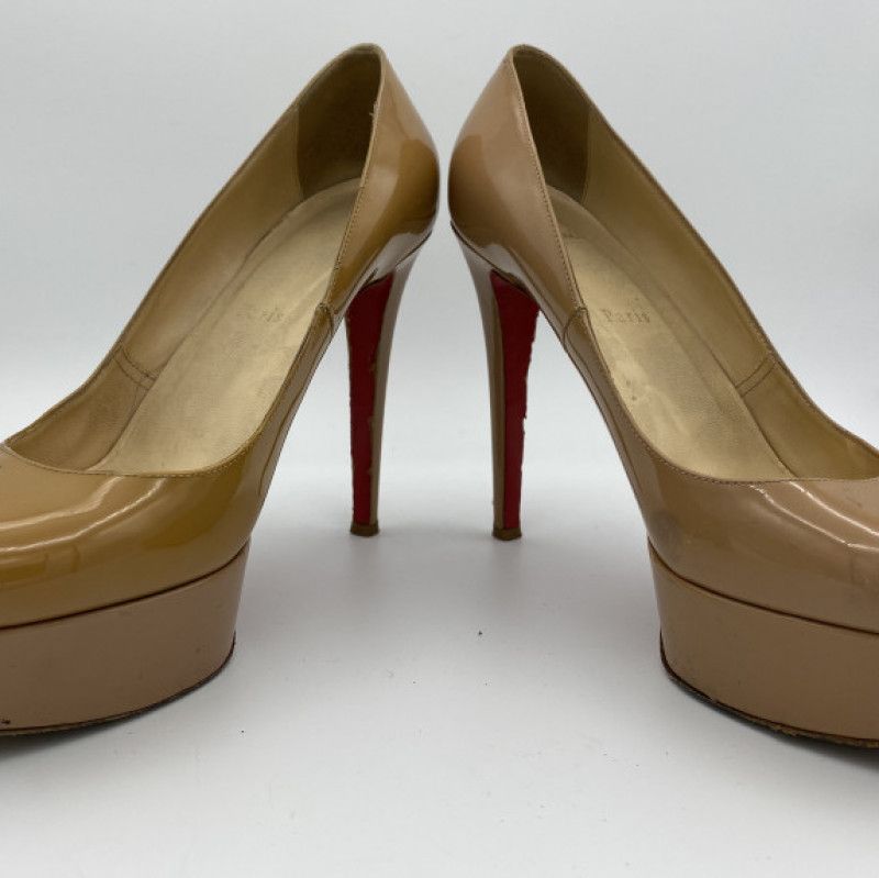 Nude patent leather Louboutin pumps