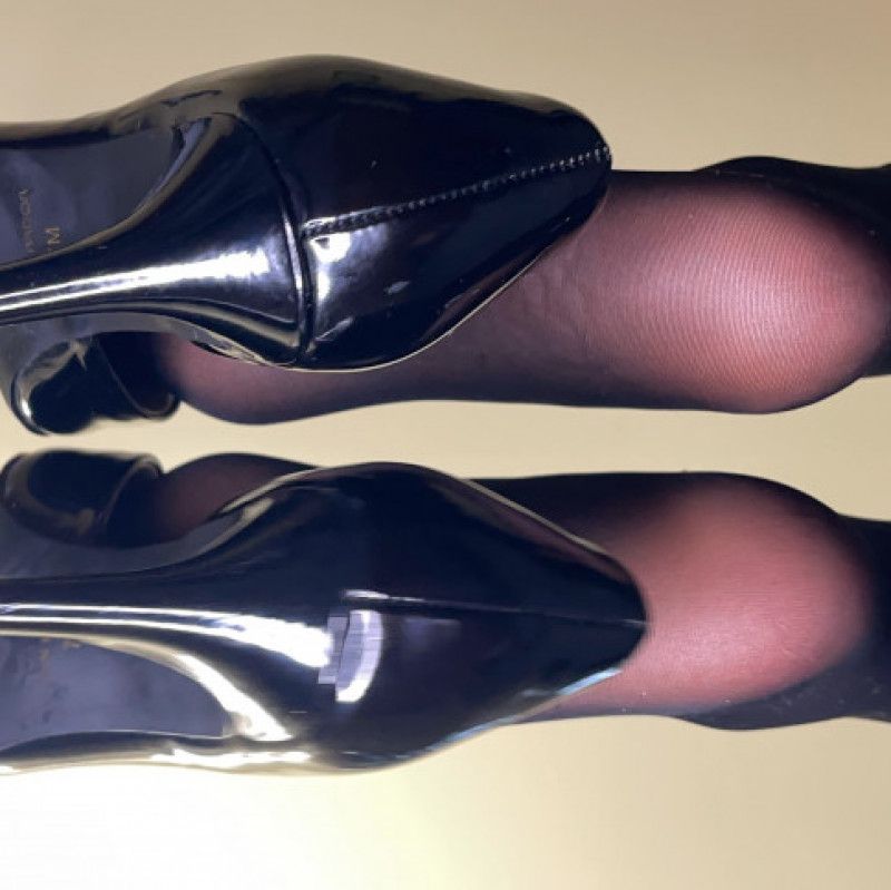 BLACK HIGH HEEL DANGLING WITH NYLONS PIC