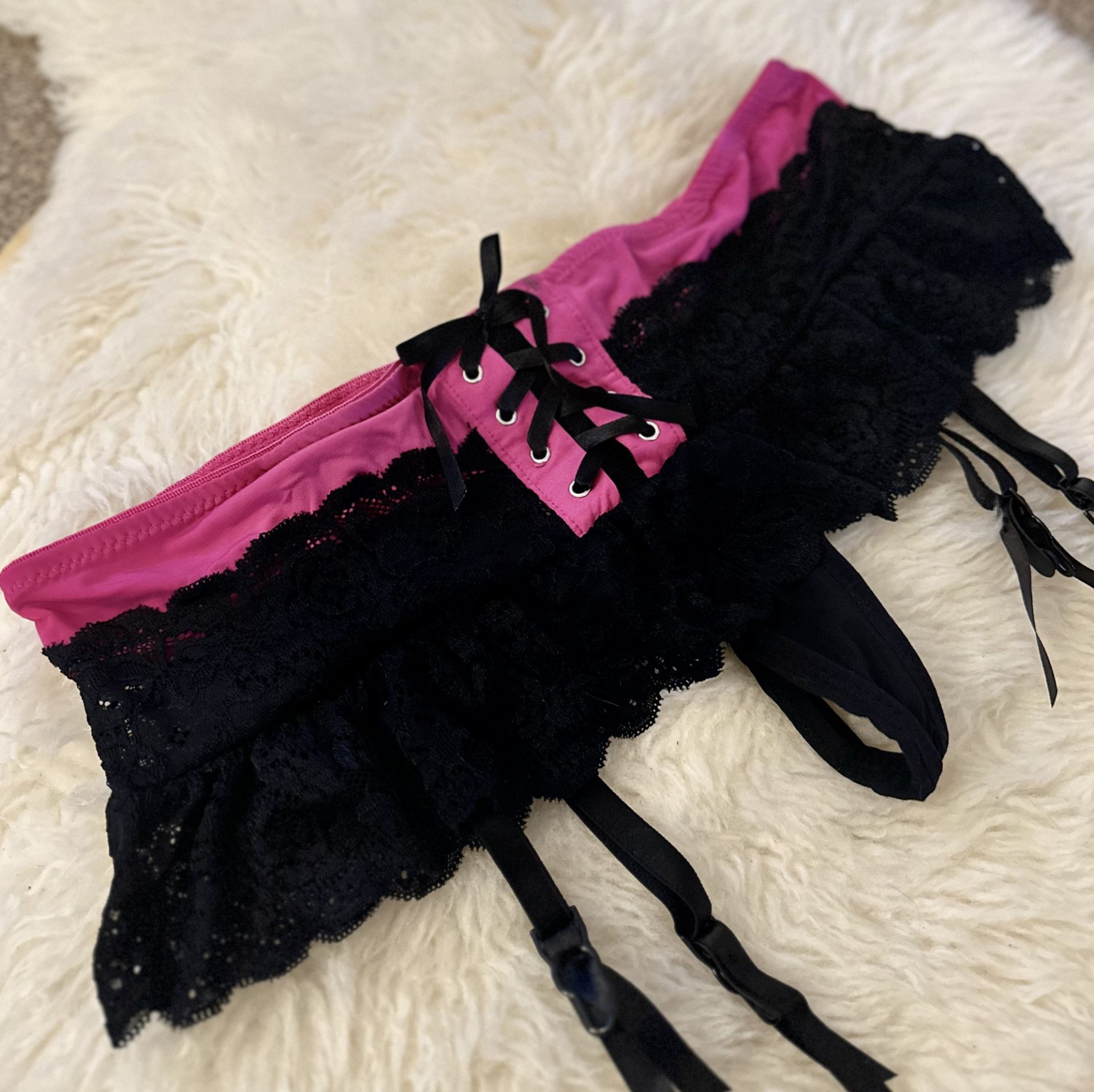 Pink and black lace suspender belt