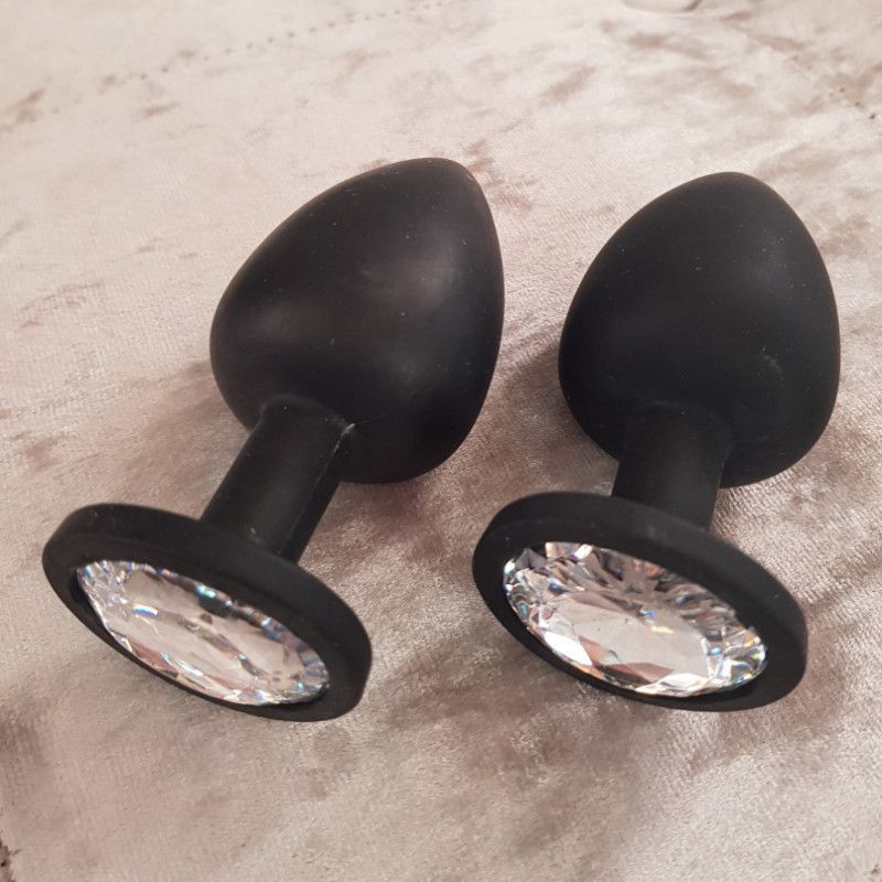 Pair of jewelled black butt plugs