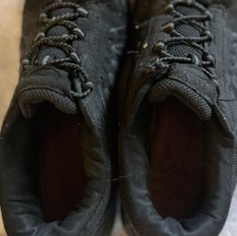 7 year old well worn off brand sneakers