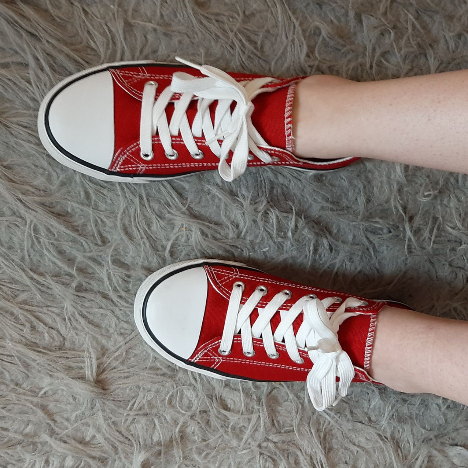 Worn Red Sneakers