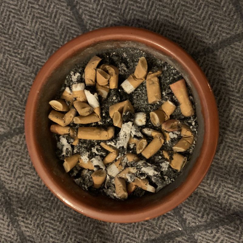 Full ashtray of cork butts