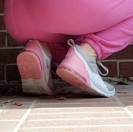 Worn pink and grey nike air sneakers