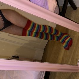 Worn rainbow knee high socks