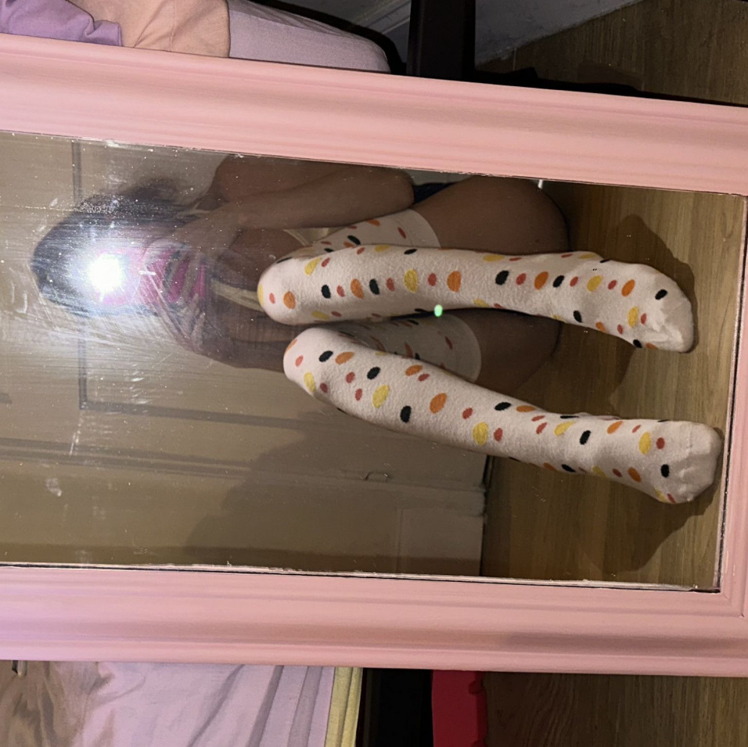 Worn spotted thigh high socks