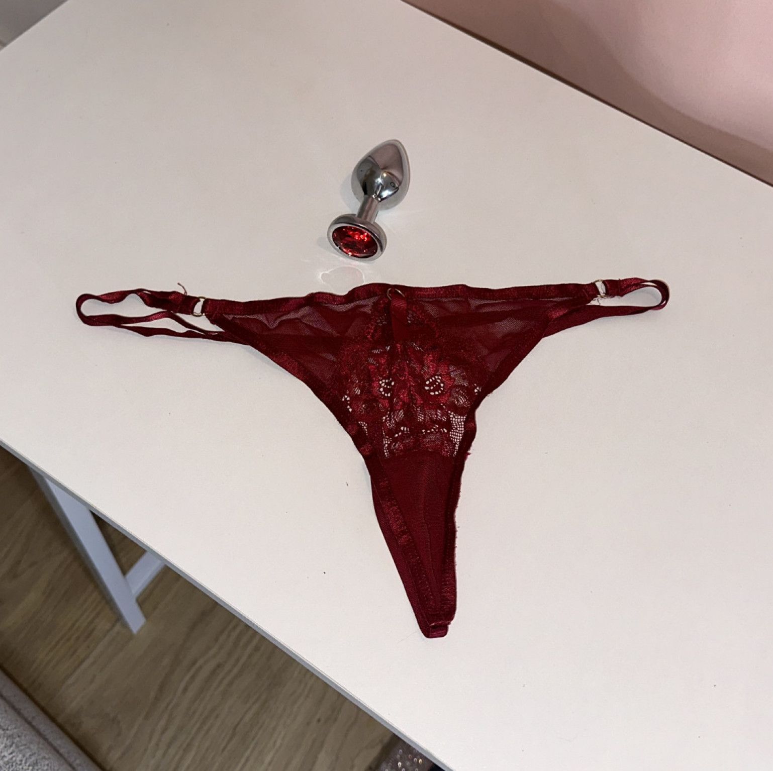 Medium red steel buttplug and Ann summer G string