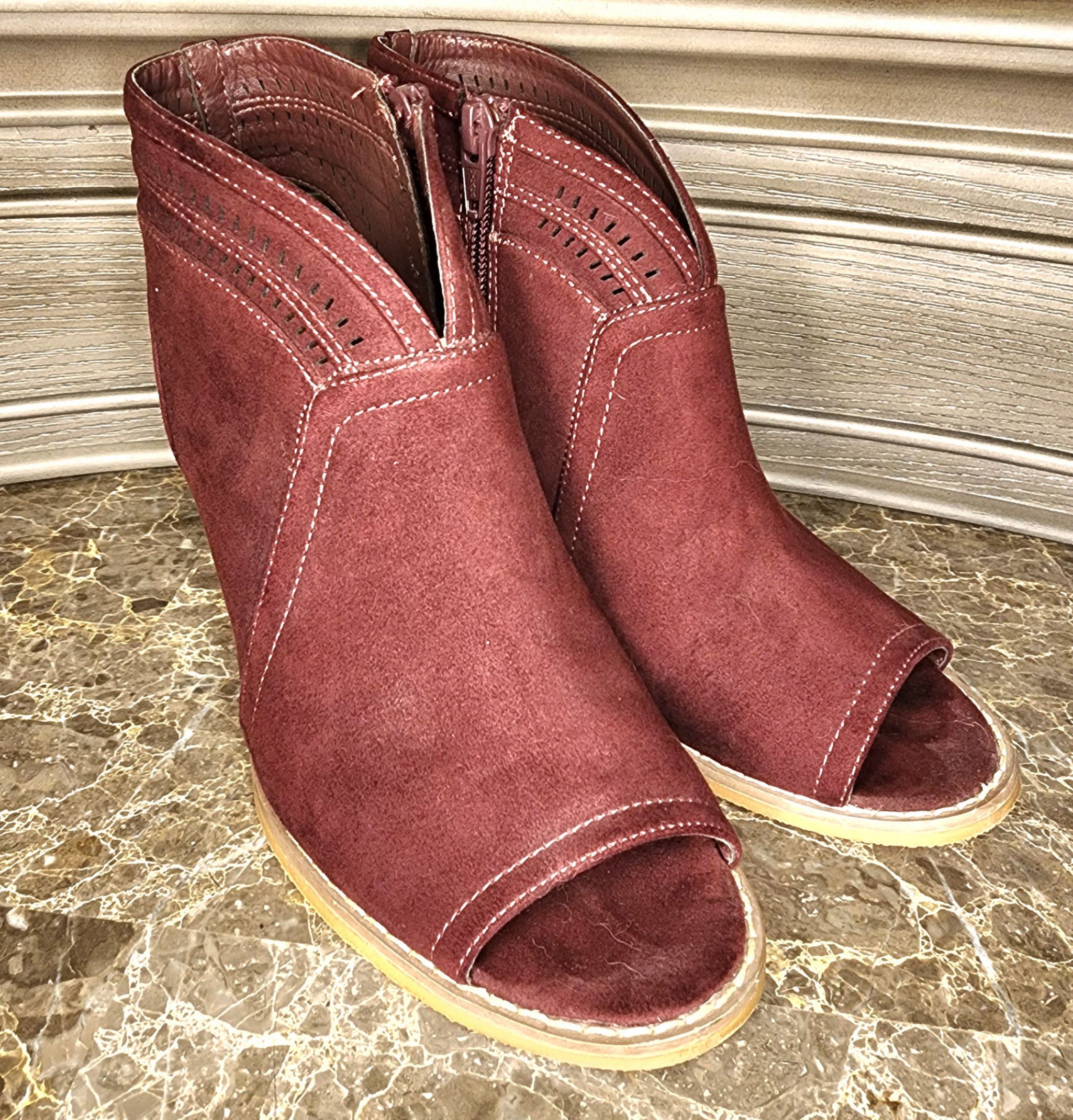 Worn open toe booties