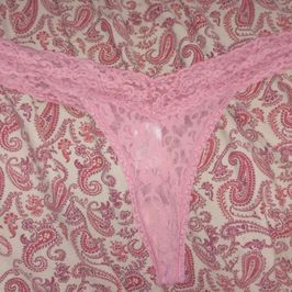 Worn pink lace thongs