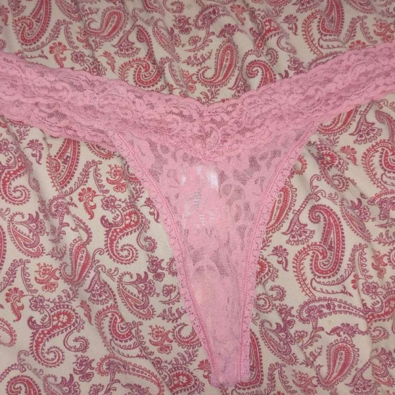 Worn pink lace thongs