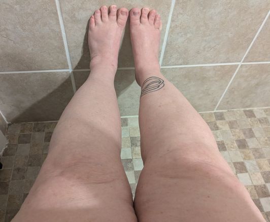 Feet and leg over the knee in part of thigh photo