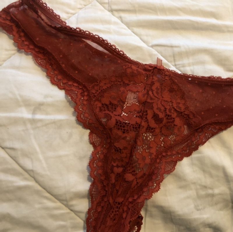 Reddish orange lace thong