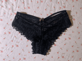 Worn black lingerie hipster bow panties