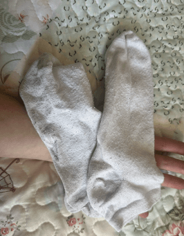 Well worn white trainer socks