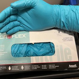 Worn pair of green Microflex nitrile gloves