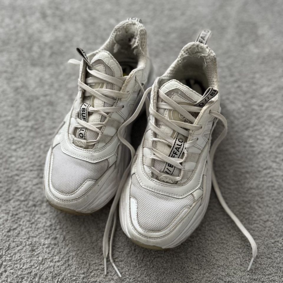 WORN WHITE SNEAKERS