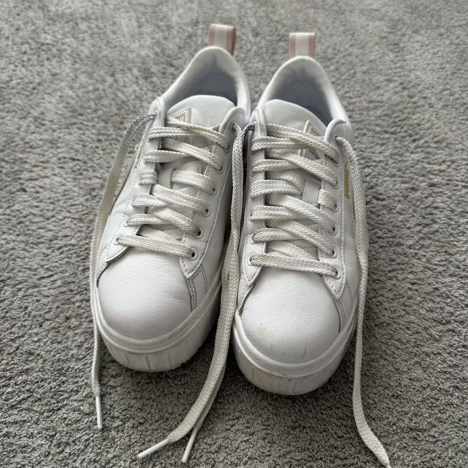 WORN WHITE PUMA SNEAKERS